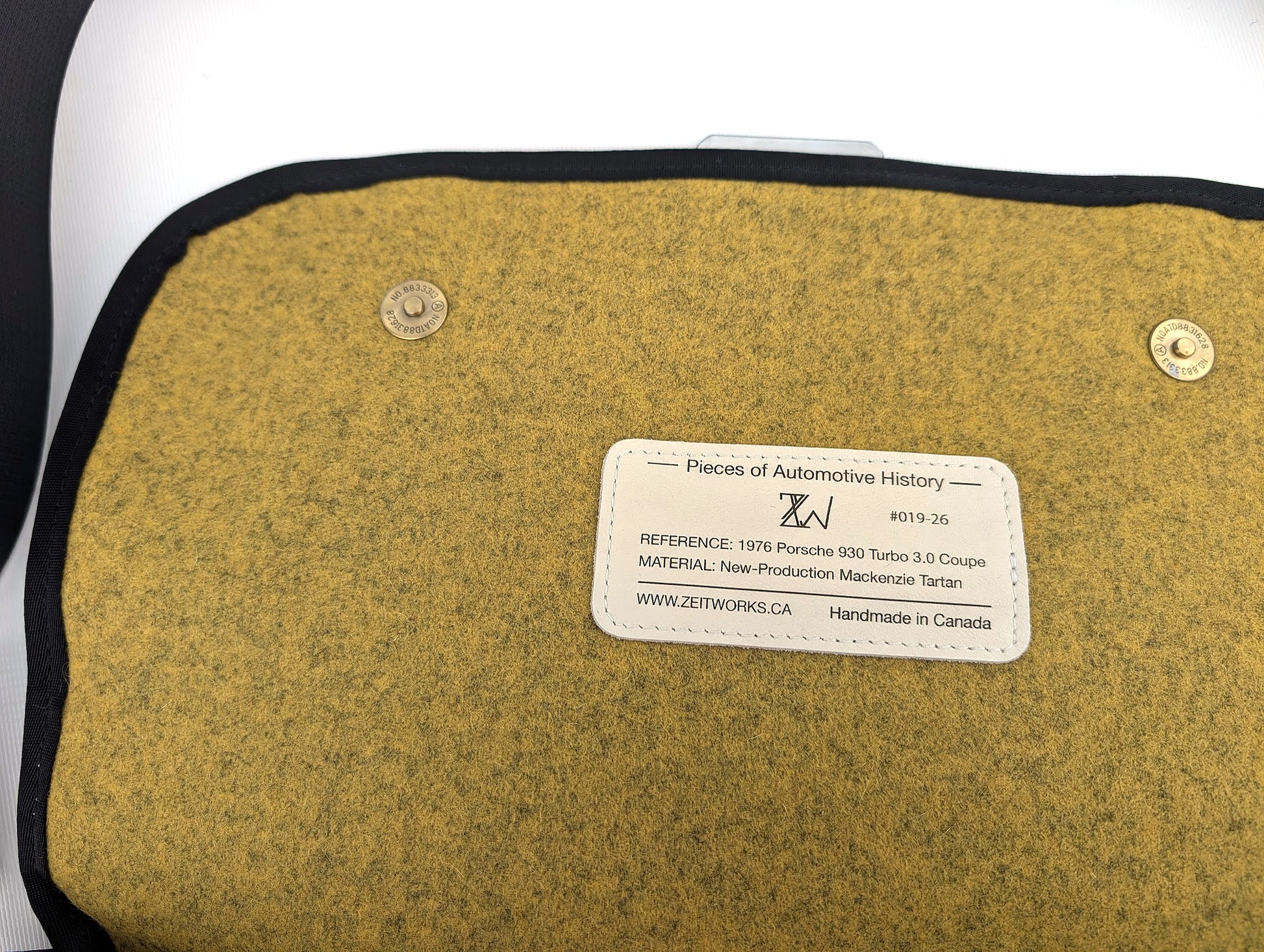 "Code 265" 930 Turbo Laptop - Mackenzie Tartan — strap detail